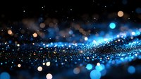 Magical glowing blue and gold bokeh lights scattered on dark background creating dreamy abstract pattern with blurred sparkles and depth effect.
