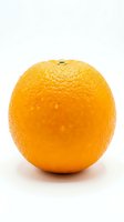 Fresh whole orange with textured peel isolated on white background, ready for food and beverage design, packaging, and culinary content use.