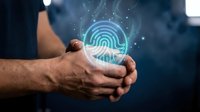 Male hands protecting glowing fingerprint with 404 error hologram in dark digital environment for cybersecurity and data protection concepts.