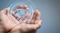 Hands holding glowing eye symbol with digital circles, representing vision, technology, surveillance, security, and innovation concepts for business and digital solutions.