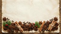 Vintage paper with star anise, cinnamon sticks, and fresh herbs arranged on wooden surface. Suitable for culinary, recipe, and seasonal design projects.