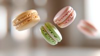 Colorful French macarons floating in air with soft bokeh background, delicate almond cookies in pastel shades for bakery and dessert concepts.