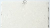 Isolated snowflake ornament on textured cream paper background, ready for holiday greeting cards, winter invitations, and seasonal design projects.
