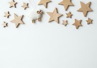 Wooden stars and reindeer ornaments arranged on white background, isolated craft supplies for holiday decorations, seasonal design elements, and festive crafting projects.