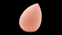 Peach-colored makeup sponge with textured surface, isolated on transparent background. Ready for beauty product design, clipart, t-shirt graphics, stickers, and print-on-demand applications.