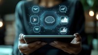 Business professional using tablet with holographic digital interface displaying brain, analytics charts and communication icons for modern technology solutions.