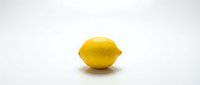 Fresh yellow lemon fruit isolated on white background for healthy cooking and citrus vitamin C nutrition concepts.