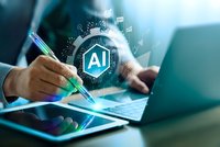 Businessman using laptop with AI artificial intelligence holographic interface and digital data analytics for machine learning technology innovation.