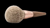 Makeup brush with natural bristles, rose gold ferrule, and wooden handle isolated on transparent background. Ready for design use on t-shirts, clipart, stickers, print-on-demand products, and sublimation projects.