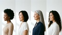 Four diverse professional women in profile view showcasing different ages and ethnicities in business attire against neutral background for corporate diversity concepts.