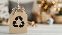 Eco-friendly gift tag with recycling symbol hanging on natural twine against warm bokeh lights background for sustainable holiday packaging and green celebrations.