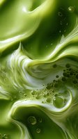 Abstract fluid art in green and white tones with swirling patterns and floating bubbles creates dynamic movement and organic flow for modern wall decor.