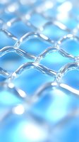 Metallic mesh pattern on blue background with selective focus creating abstract geometric texture, suitable for technology and security concepts.