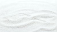 White sand texture with wavy patterns and ripples, suitable for backgrounds, design elements, beach themes, and natural surface applications.