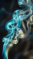 Abstract blue and golden smoke swirls creating elegant flowing patterns against dark background for creative design projects.