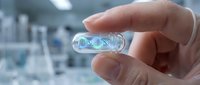 Hand holding transparent capsule with glowing DNA helix inside in modern laboratory setting for pharmaceutical research and genetic medicine development.