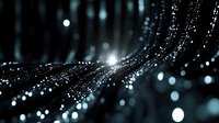 Glowing particles flow in curved lines against dark background creating magical atmosphere with bokeh light effects and depth of field blur.