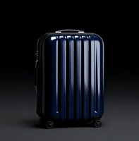 Navy blue hardshell spinner luggage with ribbed exterior design on dark background. Modern wheeled suitcase features sleek metallic finish and durable construction.
