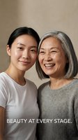 Happy Asian mother and adult daughter embracing and smiling together, representing family bonds and generational love in warm natural lighting.