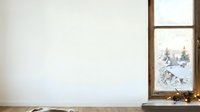 Wooden window frame with snowy winter landscape view and evergreen trees, blank white wall space for text or design placement.