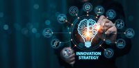 Business professional touching digital innovation strategy interface with lightbulb brain icon and connected technology symbols on blue background.