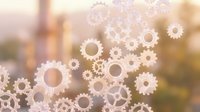 Floating gears and cogs overlay on blurred industrial cityscape background, representing technology, automation, engineering, and business process optimization concepts.