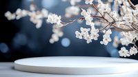 White cherry blossom branches frame elegant circular platform against soft blue bokeh background for spring product display and promotional content.