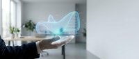 Businessperson holding glowing wireframe car hologram in modern office environment, representing automotive technology, digital innovation, and future transportation solutions.