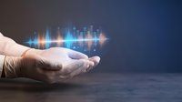 Hand in medical glove holding glowing digital sound wave visualization with bar graph elements on dark background for audio technology and healthcare concepts.