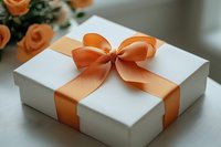 White gift box with elegant peach satin ribbon bow and roses in background on light surface, romantic present packaging for special occasions.