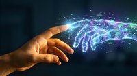 Human hand reaching toward glowing digital brain with neural network connections representing artificial intelligence and technology interaction.