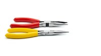 Two precision needle-nose pliers with red and yellow ergonomic handles isolated on white background for professional tool and hardware projects.