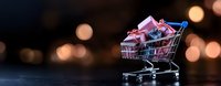 Shopping cart filled with small pink gift boxes against dark background with warm bokeh lights creating festive holiday shopping atmosphere.