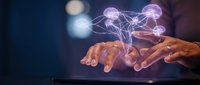Hands holding tablet displaying glowing neural network connections and digital brain nodes, representing artificial intelligence, data science, and technology innovation.