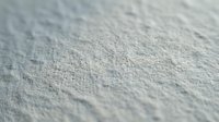 Close-up macro view of rough concrete surface texture with natural lighting showing detailed grain and weathered patterns for construction backgrounds.