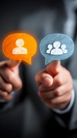 Business professional holding glowing speech bubbles with individual and group icons, representing communication and team management concepts.