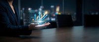 Businesswoman holding glowing holographic financial growth chart with rising arrows and success metrics in dark modern office.