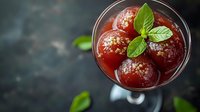 Fresh cherry cocktail with mint garnish in elegant glass, refreshing summer drink with ice and herbs for bar menu and beverage photography.