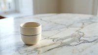 Stacked ceramic cups on marble countertop, minimalist kitchen decor, modern tableware styling for home design and lifestyle content.