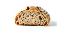Artisan sourdough bread slice showing airy crumb structure with large holes, golden crust and rustic texture isolated on white background for bakery designs.