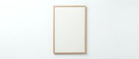 Empty wooden frame mockup on white wall for artwork display and interior design projects.