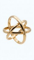Modern gold ring with interlocking bands creating geometric sculptural design isolated on white background for jewelry and fashion concepts.