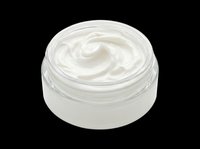 Creamy white moisturizer or skincare product in clear glass jar with white lid, isolated on transparent background. Ready for cosmetics, beauty, wellness design projects, t-shirts, and print-on-demand products.