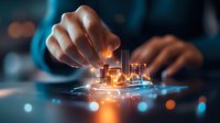 Futuristic smart city hologram emerging from digital device with glowing orange and blue lights, showcasing innovative urban development and technology advancement.