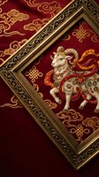 Ornate golden frame displaying traditional Asian ram artwork on rich burgundy silk with decorative cloud patterns and cultural motifs for luxury decor.