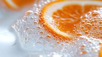 Fresh orange slices with water droplets on white surface creating refreshing citrus splash for healthy lifestyle and nutrition concepts.