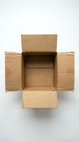 Open brown cardboard shipping box with flaps extended on white background, isolated for packaging and delivery concepts.
