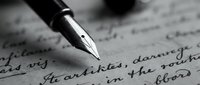 Fountain pen nib touching handwritten cursive text on aged paper, capturing the moment of writing with selective focus and monochrome tones for editorial and creative projects.