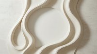 Elegant cream ceramic bowls with flowing organic curves on neutral textured surface for modern kitchen and dining decor.