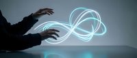 Professional businessman manipulating glowing blue energy streams with hands in futuristic digital technology concept for innovation and connectivity.